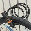 Antifurt bicicleta cu suport prindere si functie lumina stop, baterie reincarcabila, West Biking, grosime 1.2 cm, cablu otel, ABS, PVC, inchidere cu cifru iluminat LED , lungime 120 cm, rezistent