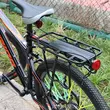 Portbagaj bicicleta MTB spate cu stop reflectorizant rosu, prindere pe tija, sarcina maxima 50 kg, 53 x 14 x 35.5 cm, aliaj aluminiu, kit montare inclus, negru